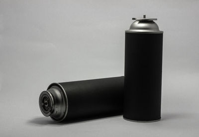 Close-up of bottle on table against white background