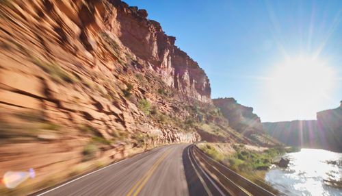 Road amidst mountains against sky