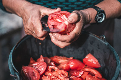 Cropped hand of man preparing food