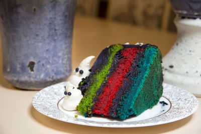 Close-up of multi colored candies in plate on table