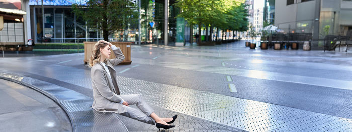 Rear view of woman walking on street