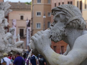 Close-up of statue against building