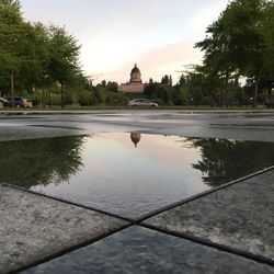 Reflection of church in puddle