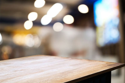 Close-up of illuminated table in restaurant