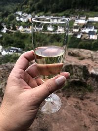 Close-up of hand holding glass of wine