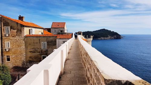 Panoramic view of sea and buildings against sky