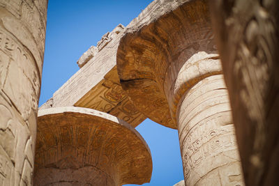 Hieroglyphs on the remains of the ancient karnak temple in luxor, egypt