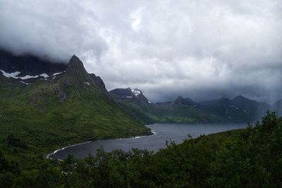 Scenic view of lake and mountains against sky