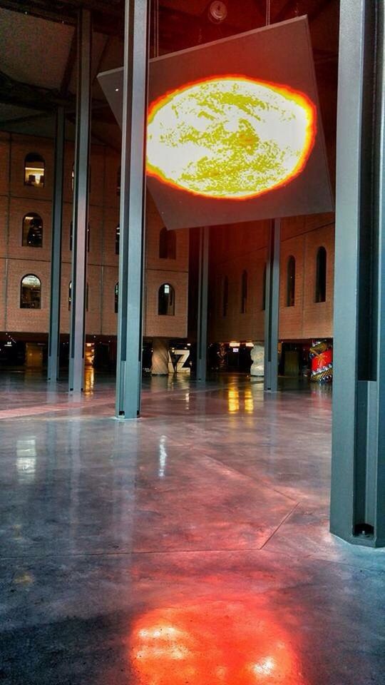 indoors, illuminated, architecture, built structure, window, reflection, lighting equipment, glass - material, flooring, empty, no people, absence, orange color, architectural column, ceiling, city, tiled floor, interior, night, glowing