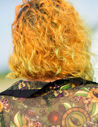 Rear view of woman with wavy hair
