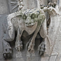 Statues on stone wall