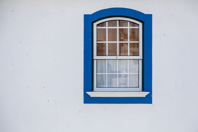 Closed window of white building