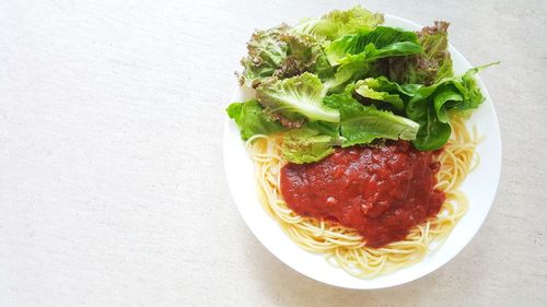 High angle view of fresh salad in plate on table