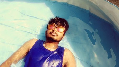 Young man in swimming pool