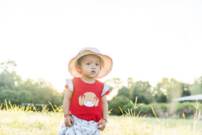 Toddler's first steps in the park. concept, learning and trying.