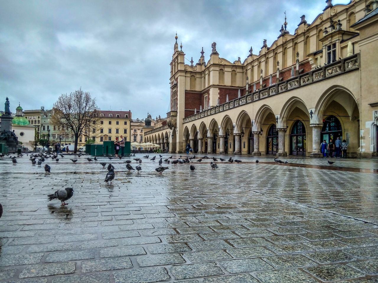 building exterior, architecture, built structure, sky, cloud - sky, city, arch, the past, history, tourism, building, incidental people, day, street, travel destinations, travel, nature, group of people, wet, outdoors, courtyard, rain