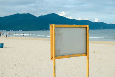 Close-up of beach against sky