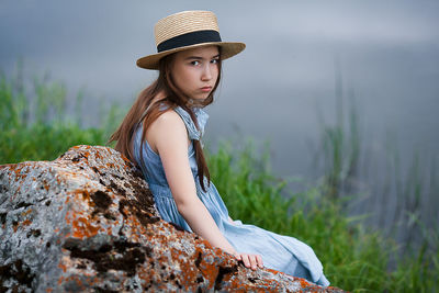 Portrait of beautiful young woman wearing rock