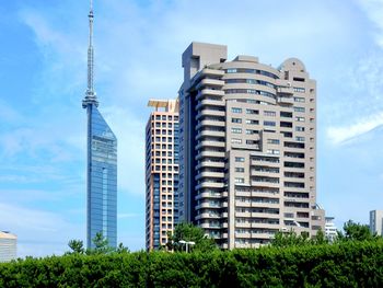 Low angle view of buildings against blue sky