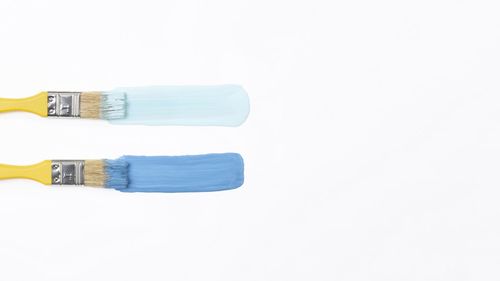 High angle view of chairs against white background