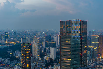 Modern buildings in city against sky