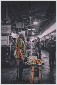 People at market stall in city