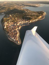 Aerial view of city by sea