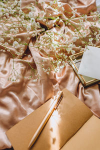 High angle view of paper box on bed