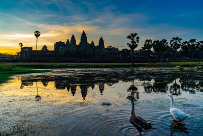 Scenic view of lake against sky during sunset