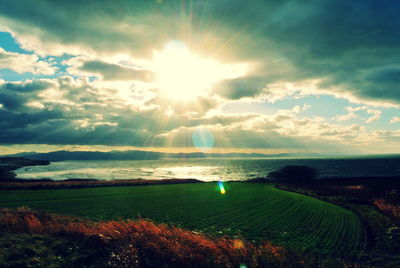 Scenic view of landscape against cloudy sky