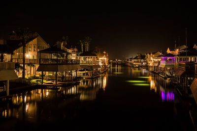 Reflection of illuminated buildings in water at night