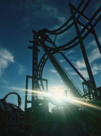 Low angle view of rollercoaster against sky