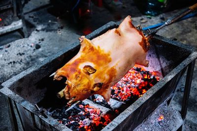 High angle view of meat on barbecue grill