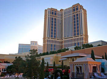 Low angle view of buildings against blue sky