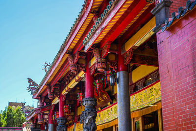 Low angle view of temple against building
