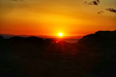 Scenic view of landscape against sky during sunset