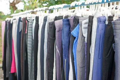 Second hand clothes and pants with quality brands imported from abroad are sold on the roadside.