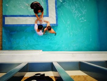 High angle view of people swimming in pool