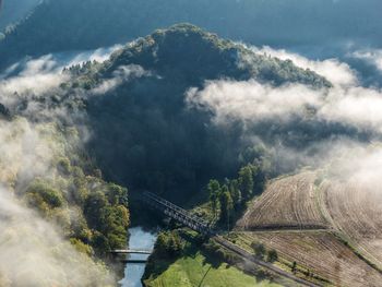 High angle view of bridge over mountain against sky