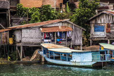 View of boats moored in canal against buildings