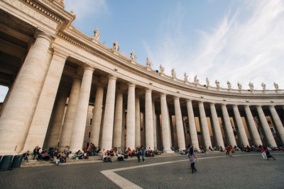 Group of people in front of historical building