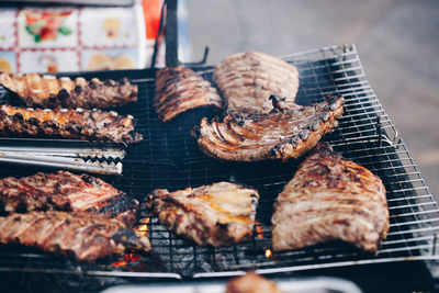 Close-up of meat on barbecue grill