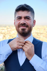 Portrait of man standing outdoors