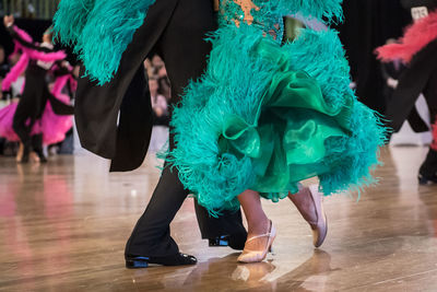 Low section of people dancing on floor