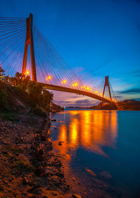 View of suspension bridge at night