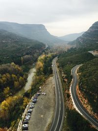 High angle view of road amidst mountains against sky