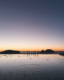 Scenic view of beach against sky during sunset