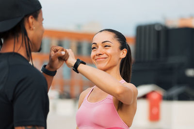 Portrait of young woman exercising in gym