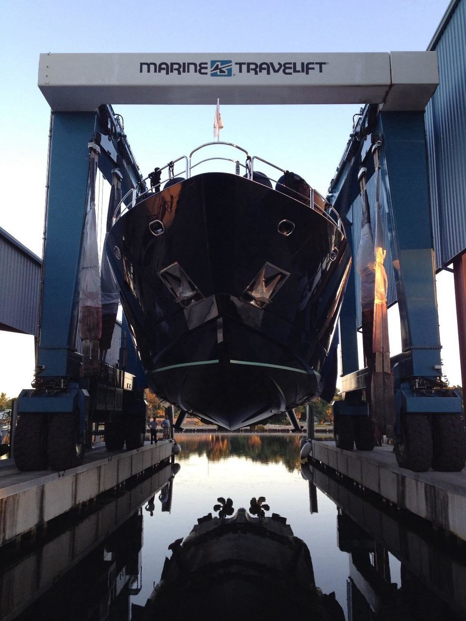 architecture, built structure, transportation, water, building exterior, sky, mode of transport, reflection, nautical vessel, river, bridge - man made structure, connection, clear sky, travel, outdoors, low angle view, travel destinations, metal, train - vehicle, day