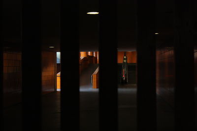 Empty corridor of illuminated building